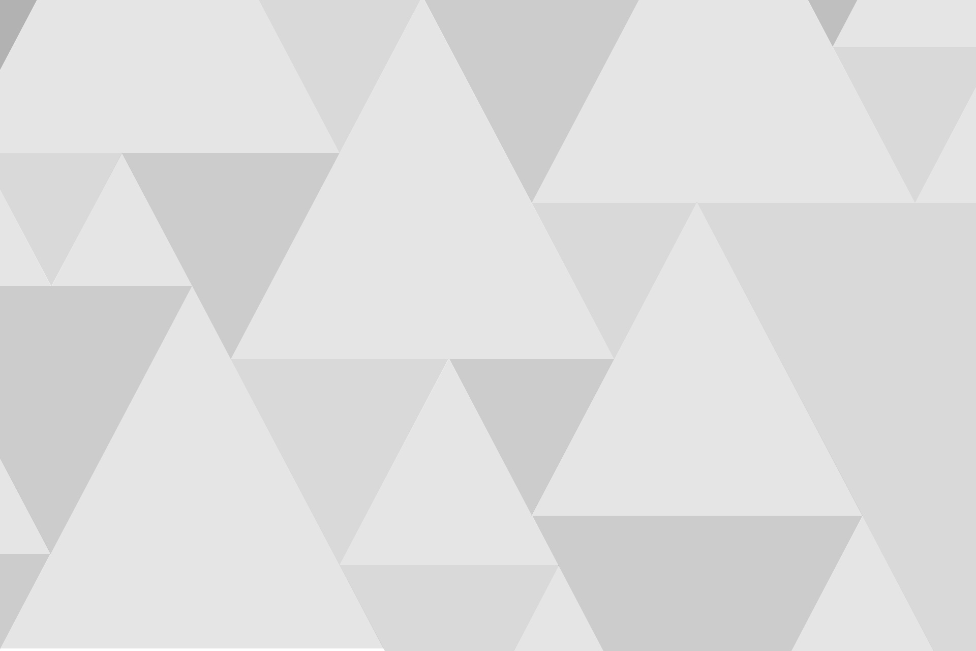 Abstract geometric pattern of light and medium gray triangles